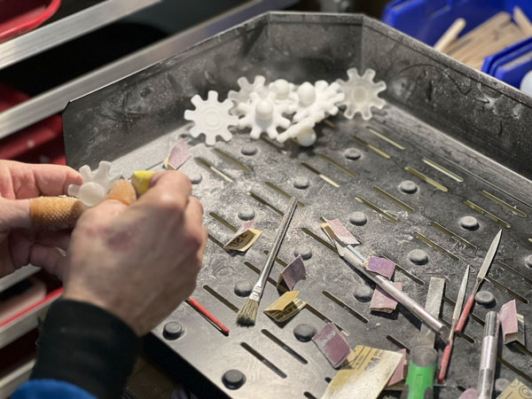 High-quality fabricated brand display piece created with large-scale 3D printing for commercial and event marketing.