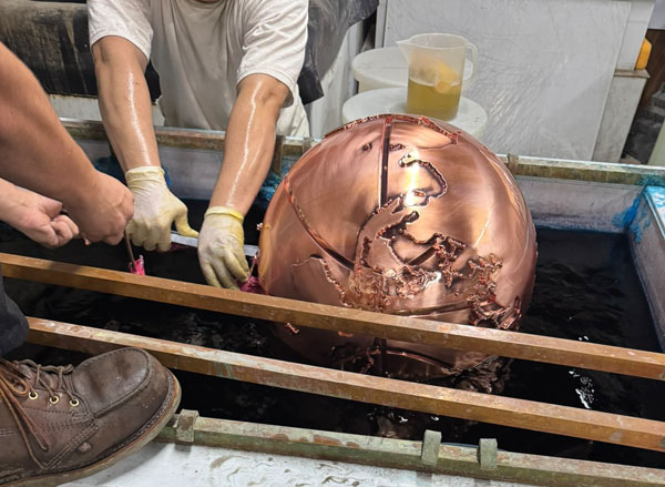 High-quality fabricated brand display piece created with large-scale 3D printing for commercial and event marketing.